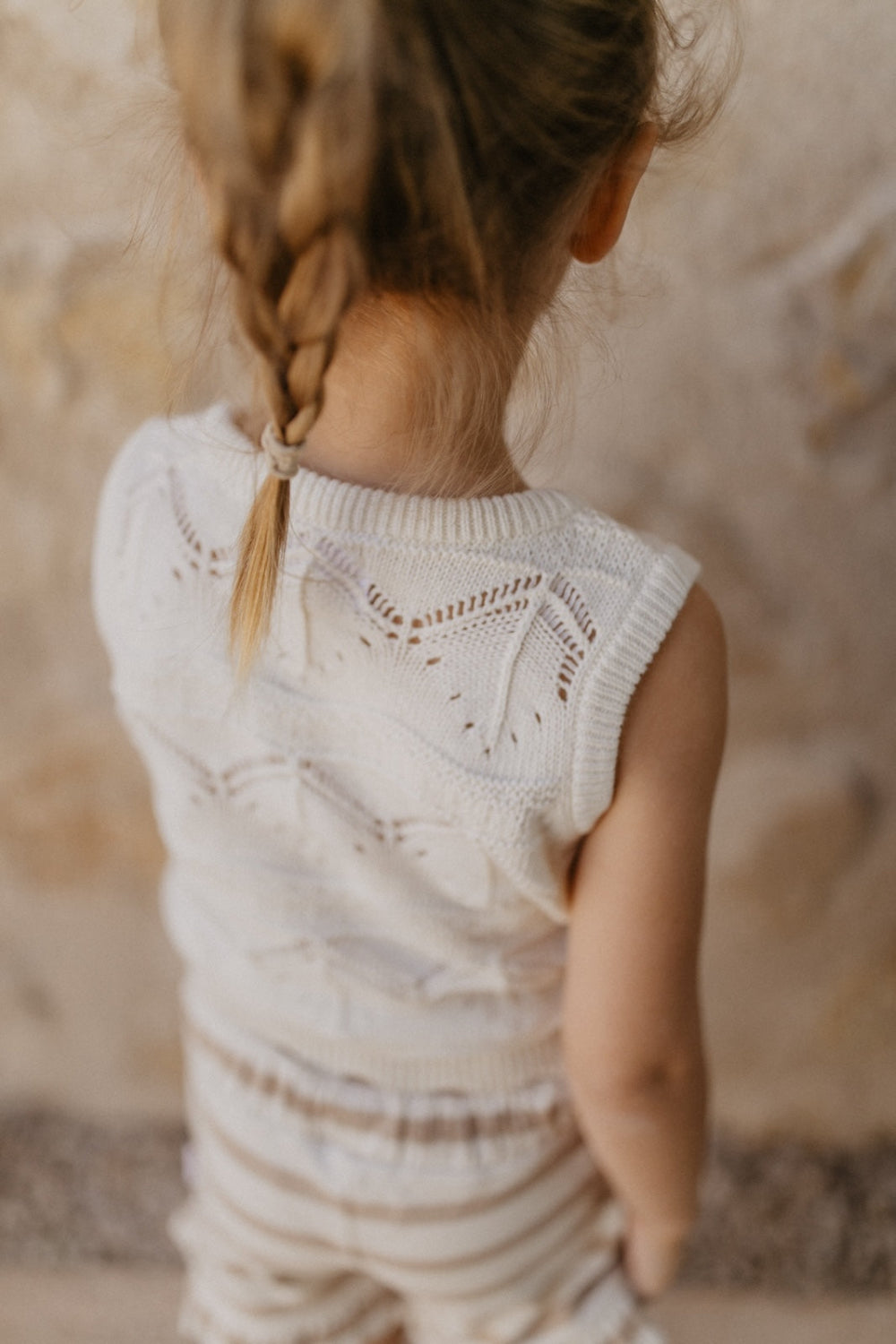 Knitted top with intricate lace pattern